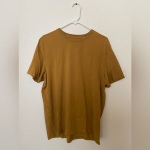 Mustard t-shirt.
